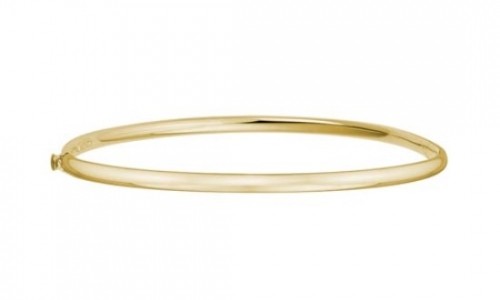 Minimalist and slender yellow gold bangle