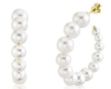 A pair of pearl hoop earrings set in yellow gold by Shy Creation
