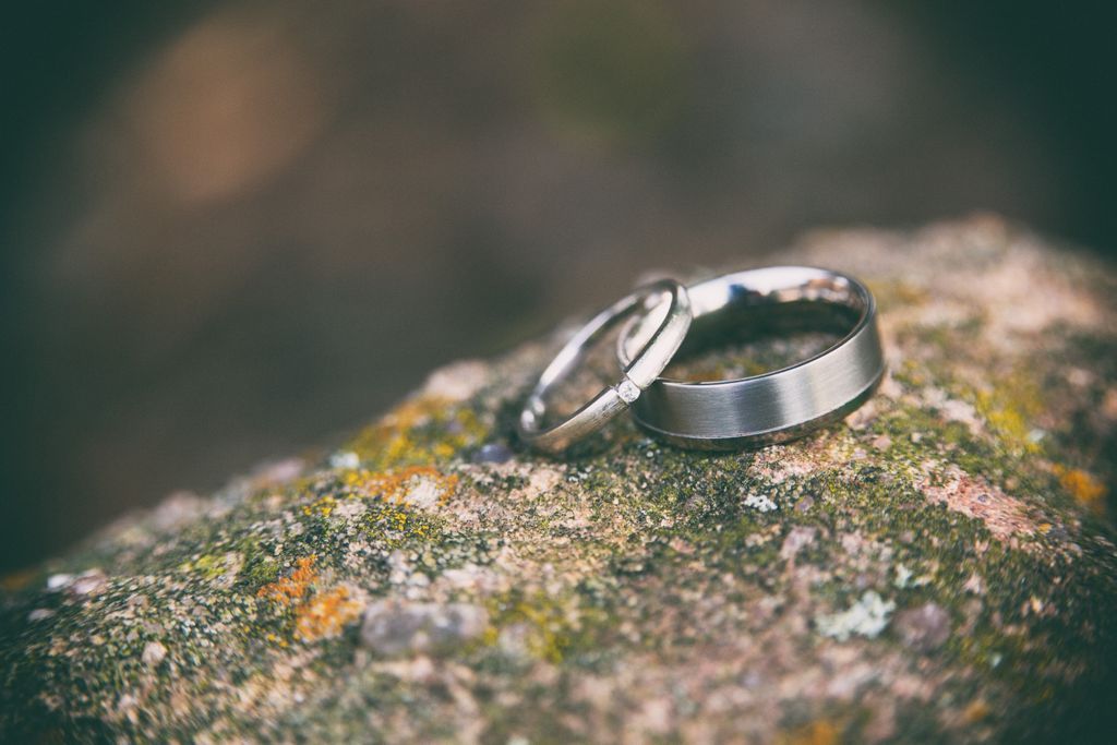 Pair of wedding rings balanced against each other