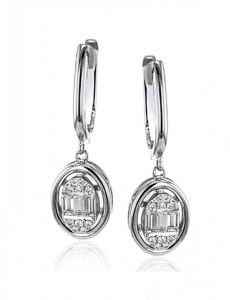 a pair of diamond drop earrings by Simon G.