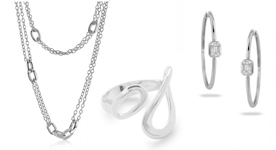 three pieces of silver jewelry: a chain necklace, ring and hoop earrings