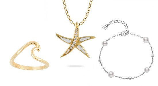a yellow gold fashion ring, a starfish necklace, and a pearl bracelet